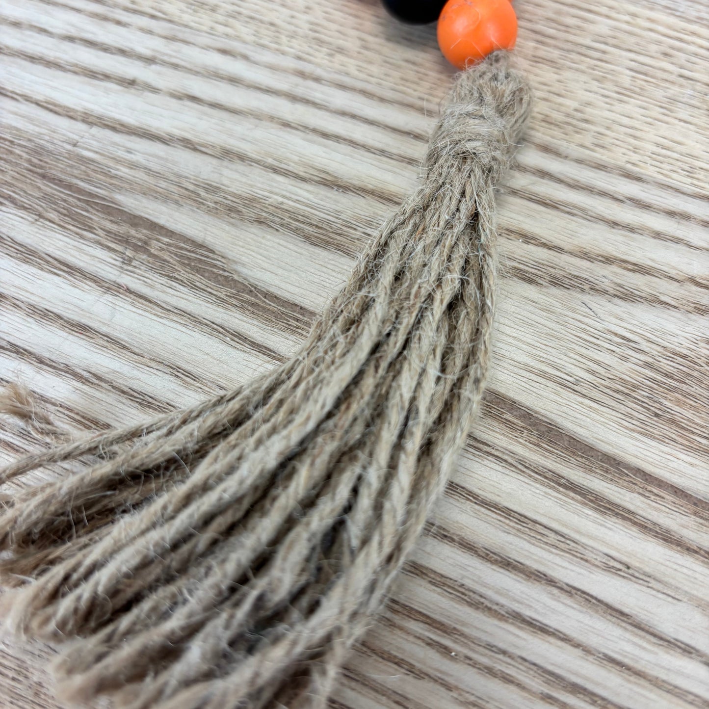 Black & Orange Bead Loop with Tassel